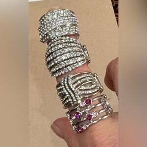 BUNDLE OF 4 RINGS SILVER COLLOR FEATURES STRETCHY  BAND FOR A FLEXIBLE FIT.